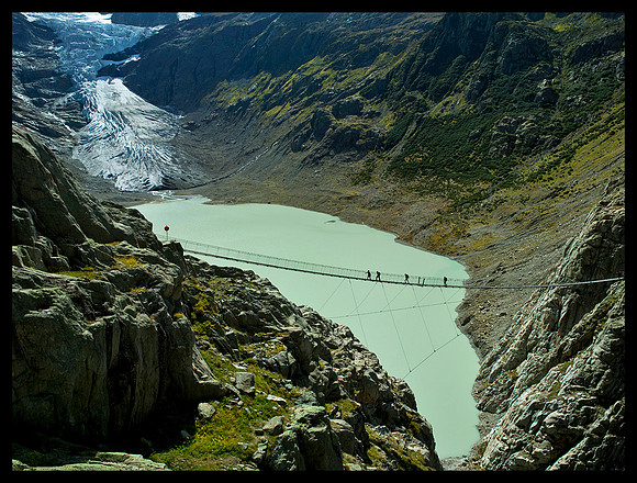 Swinging bridge and glacier